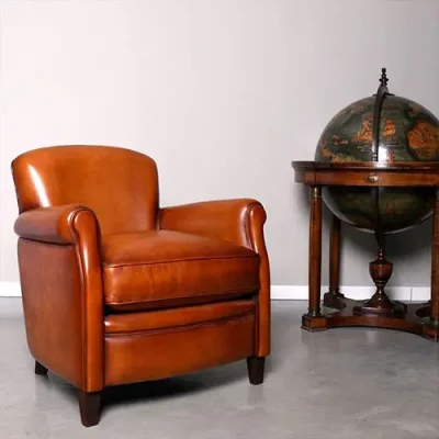 Fauteuil club le parisien en cuir de basane couleur cognac