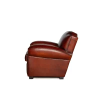 Cognac Petit Moustache leather club chair in side view