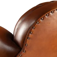 Eugène havana leather club chair, zoom on the upholstery nails